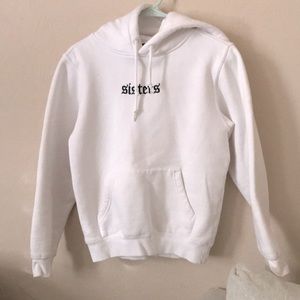 James Charles Sister white sweater